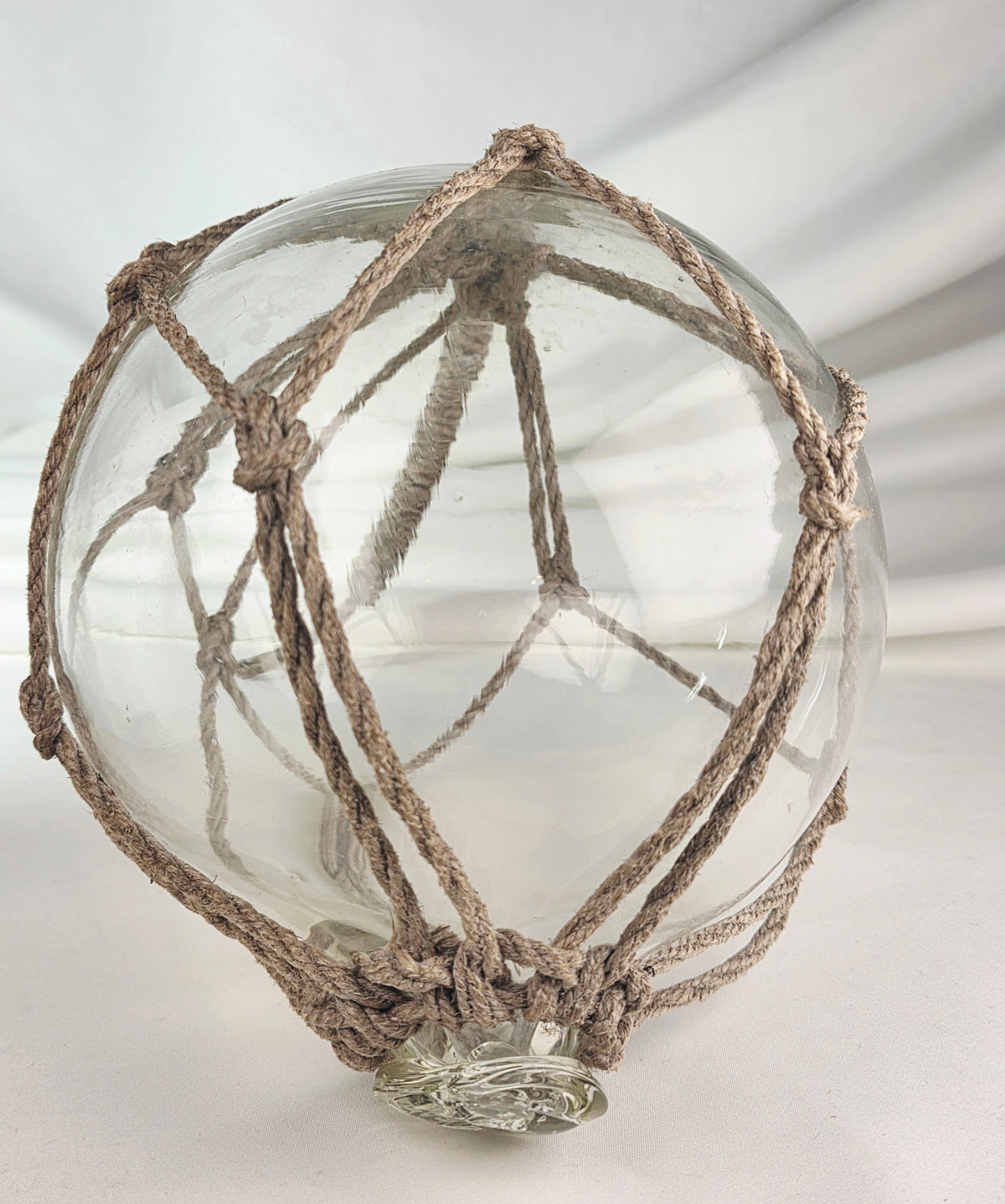 Vintage Clear Glass Fishing Float with Intricate Rope Netting – 7" Coastal Buoy with Internal "Sea-Mist" Patina Hand Blown