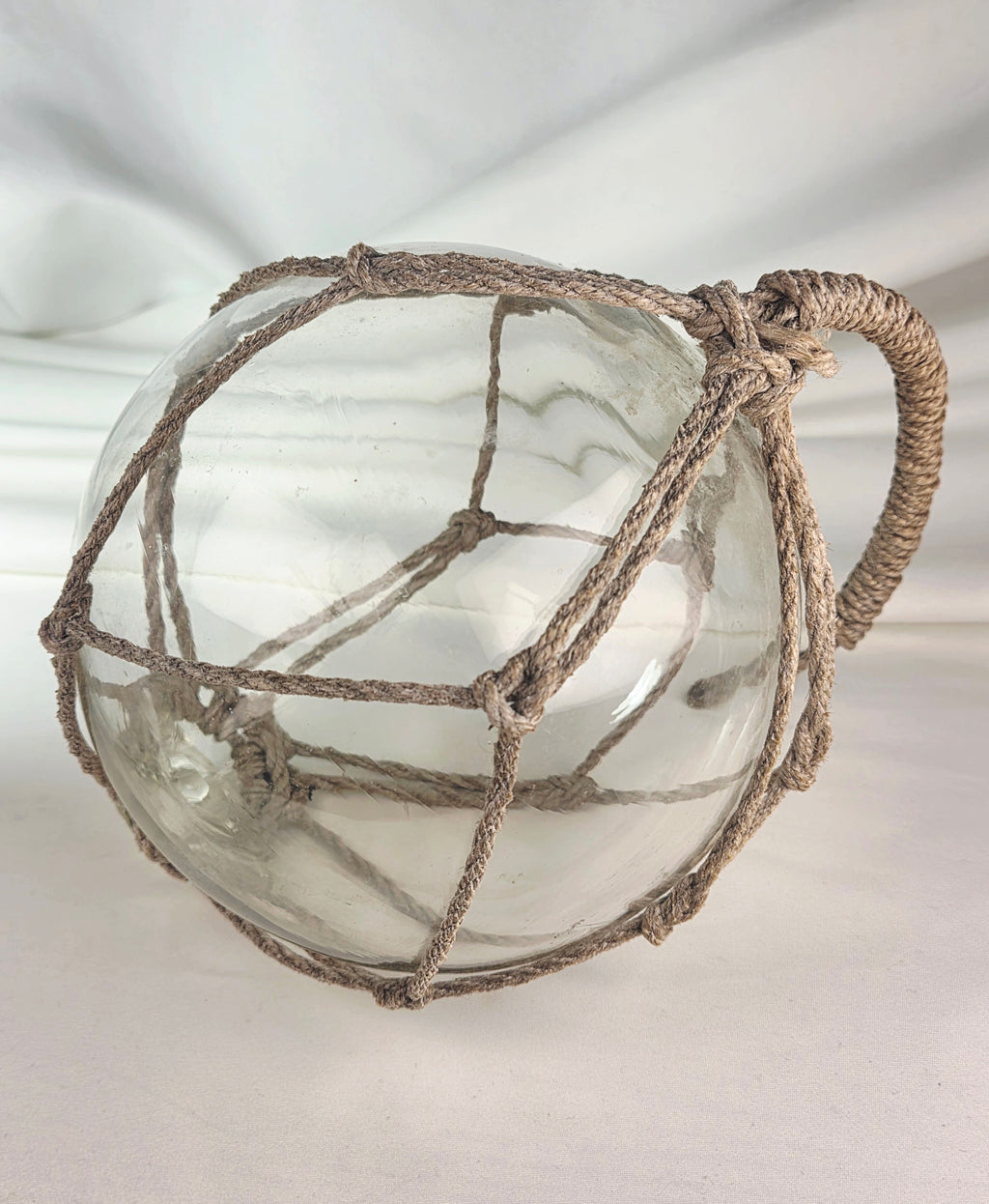 Vintage Clear Glass Fishing Float with Intricate Rope Netting – 7" Coastal Buoy with Internal "Sea-Mist" Patina Hand Blown