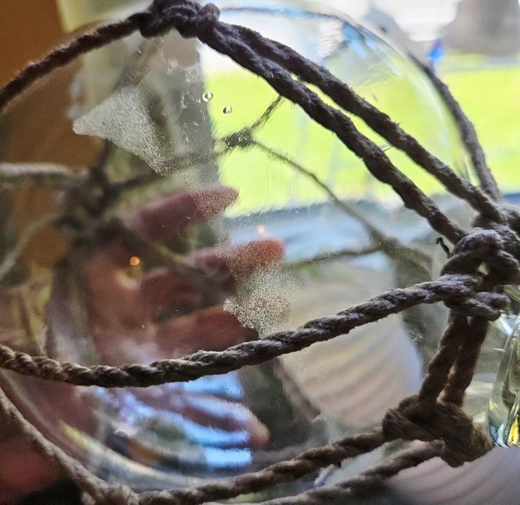 Vintage Clear Glass Fishing Float with Intricate Rope Netting – 7" Coastal Buoy with Internal "Sea-Mist" Patina Hand Blown