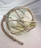 Vintage Light Amber Glass Fishing Float with Rope Netting – 7" Maritime Buoy with Internal Sea Mist Patina Hand Blown