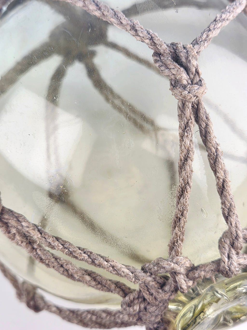 Vintage Light Amber Glass Fishing Float with Rope Netting – 7" Maritime Buoy with Internal Sea Mist Patina Hand Blown