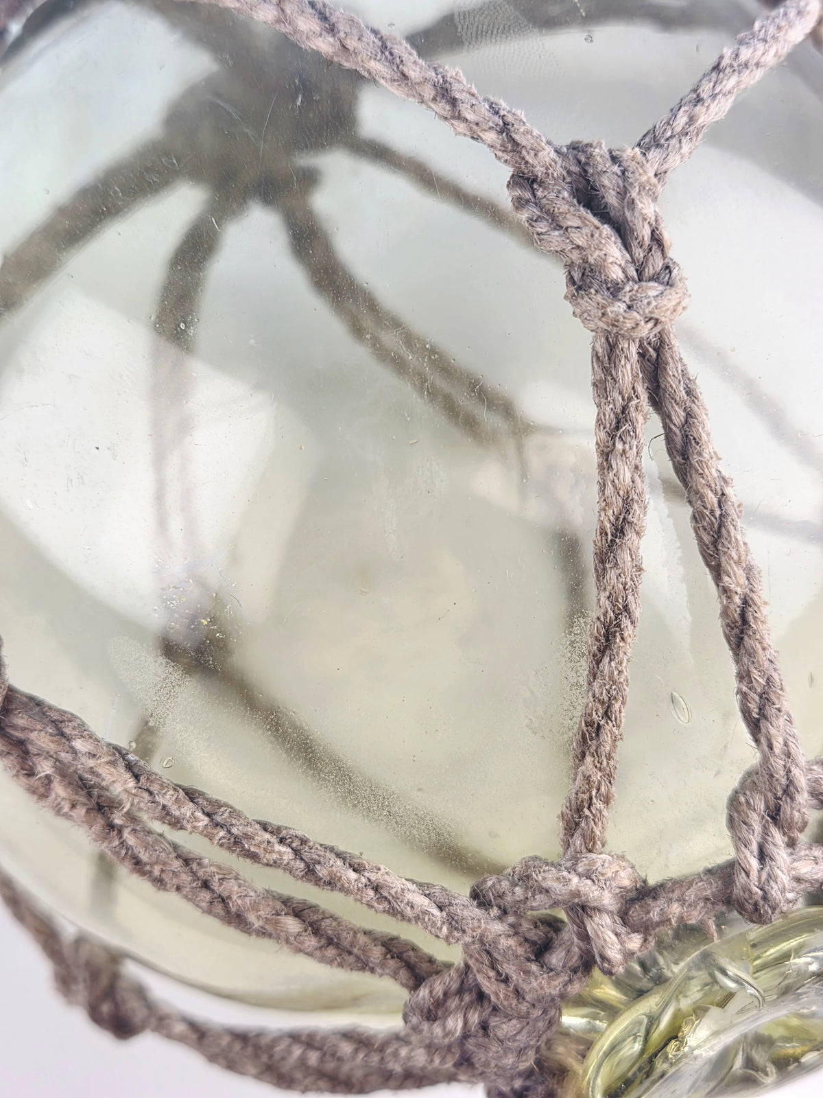 Vintage Light Amber Glass Fishing Float with Rope Netting – 7" Maritime Buoy with Internal Sea Mist Patina Hand Blown