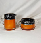 Vintage Orange Black Glass Creamer & Sugar Bowl Set Silver-Tone Floral Overlay