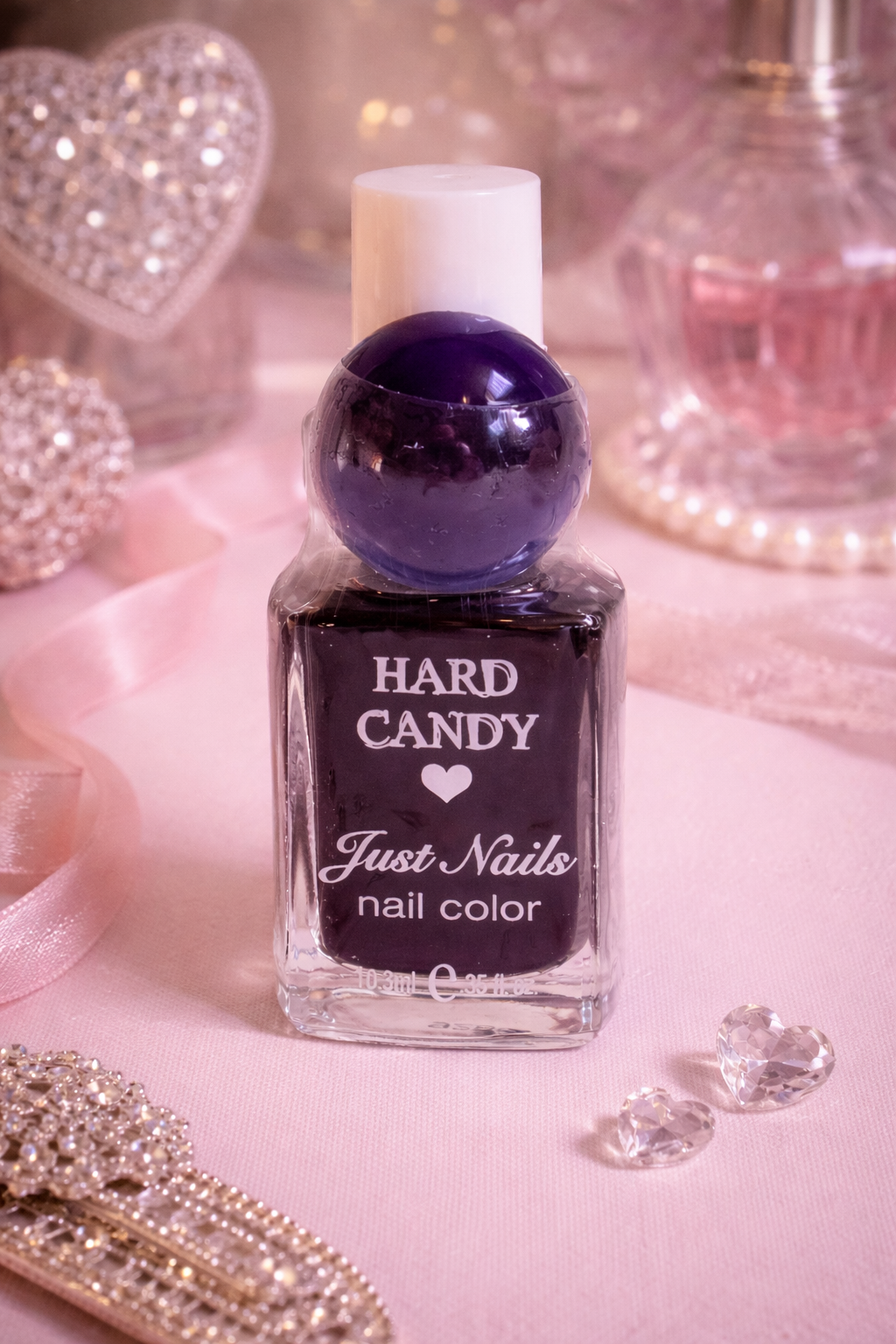 Purple nail polish bottle labeled 'Hard Candy Just Nails' deep purple vintage nail polish collectors vanity