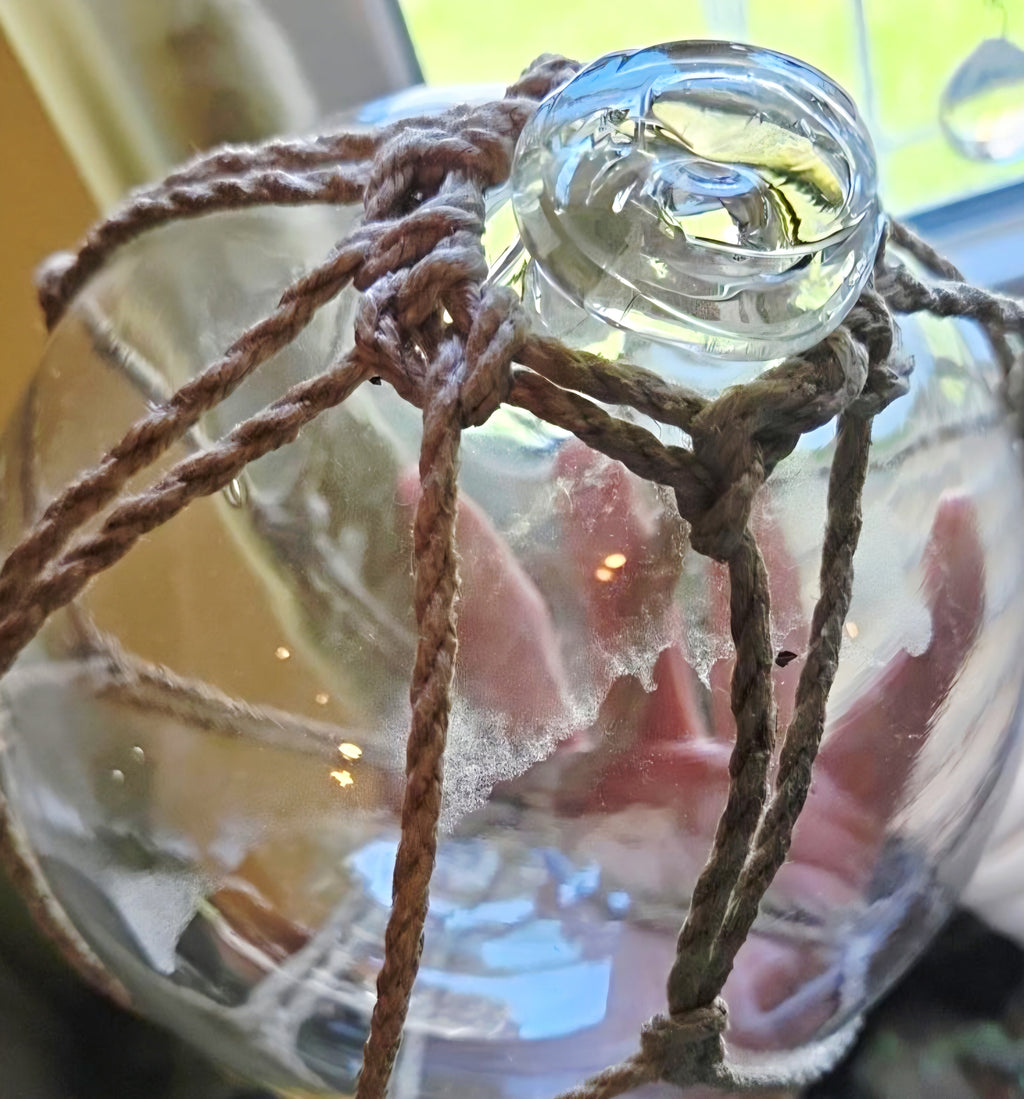 Vintage Clear Glass Fishing Float with Intricate Rope Netting – 7" Coastal Buoy with Internal "Sea-Mist" Patina Hand Blown