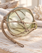 Vintage Light Amber Glass Fishing Float with Rope Netting – 7" Maritime Buoy with Internal Sea Mist Patina Hand Blown