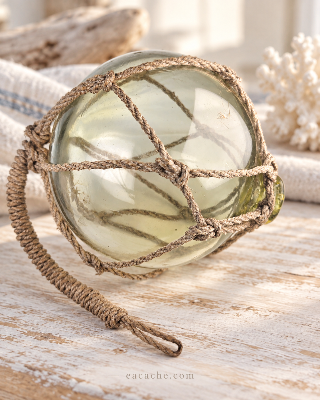 Vintage Light Amber Glass Fishing Float with Rope Netting – 7" Maritime Buoy with Internal Sea Mist Patina Hand Blown