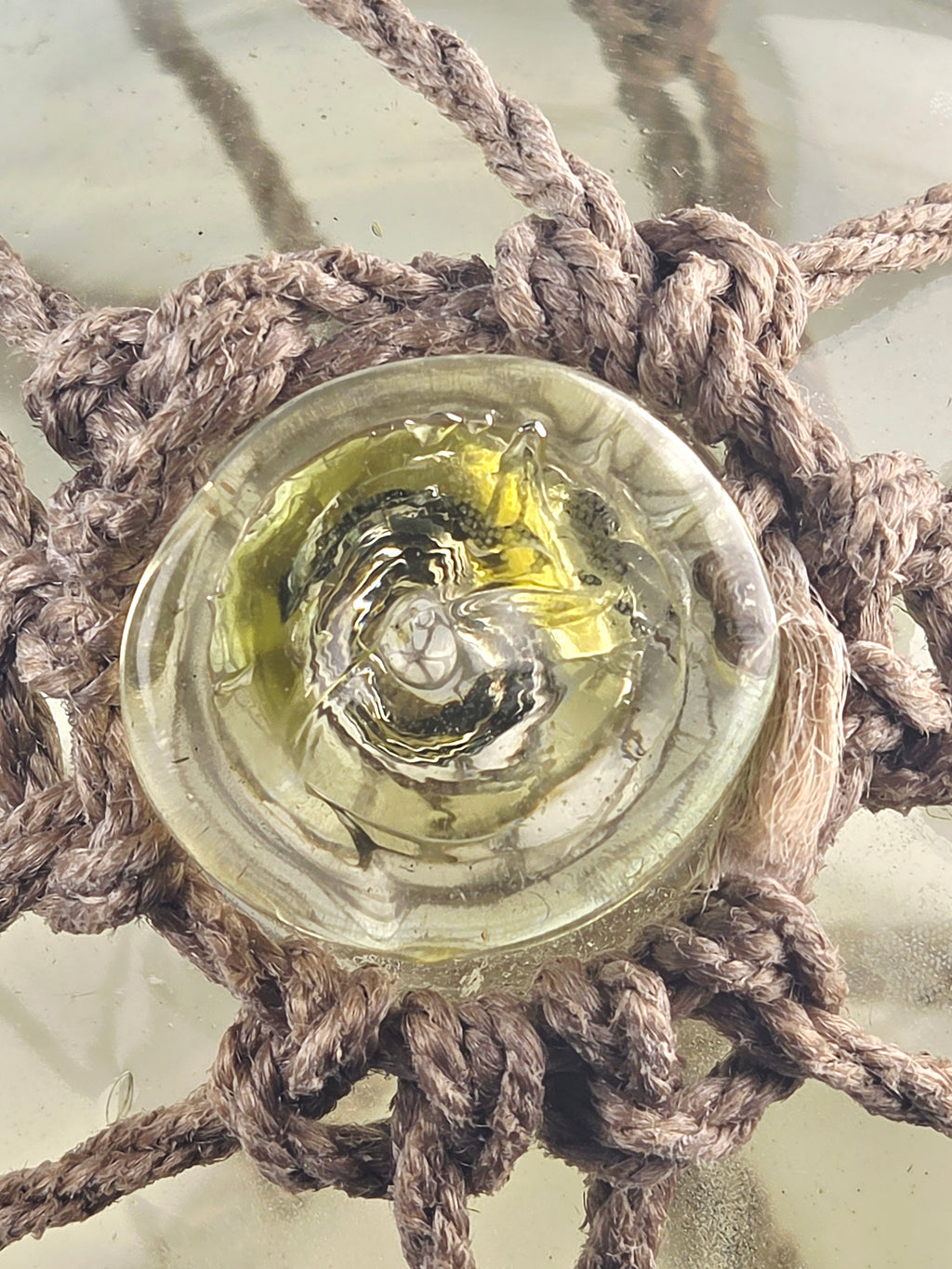 Vintage Light Amber Glass Fishing Float with Rope Netting – 7" Maritime Buoy with Internal Sea Mist Patina Hand Blown
