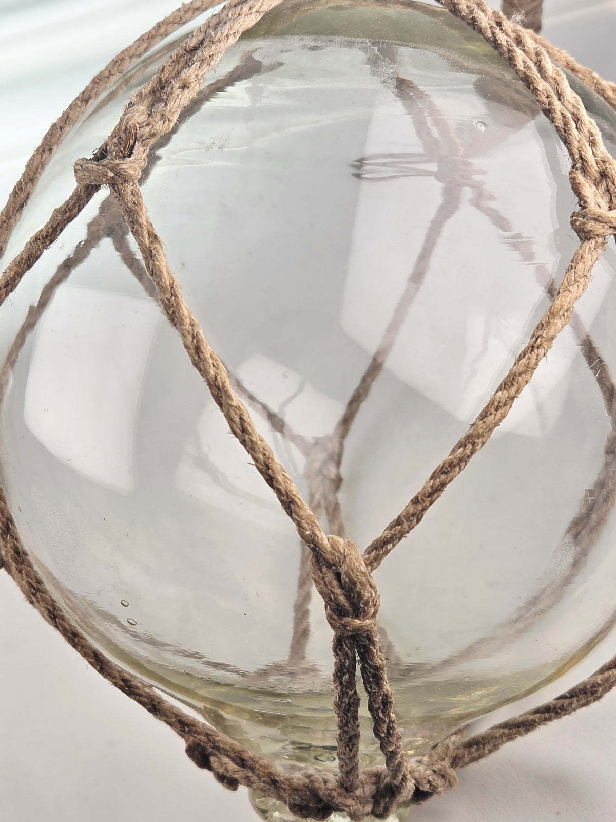 Vintage Clear Glass Fishing Float with Intricate Rope Netting – 7" Coastal Buoy with Internal "Sea-Mist" Patina Hand Blown