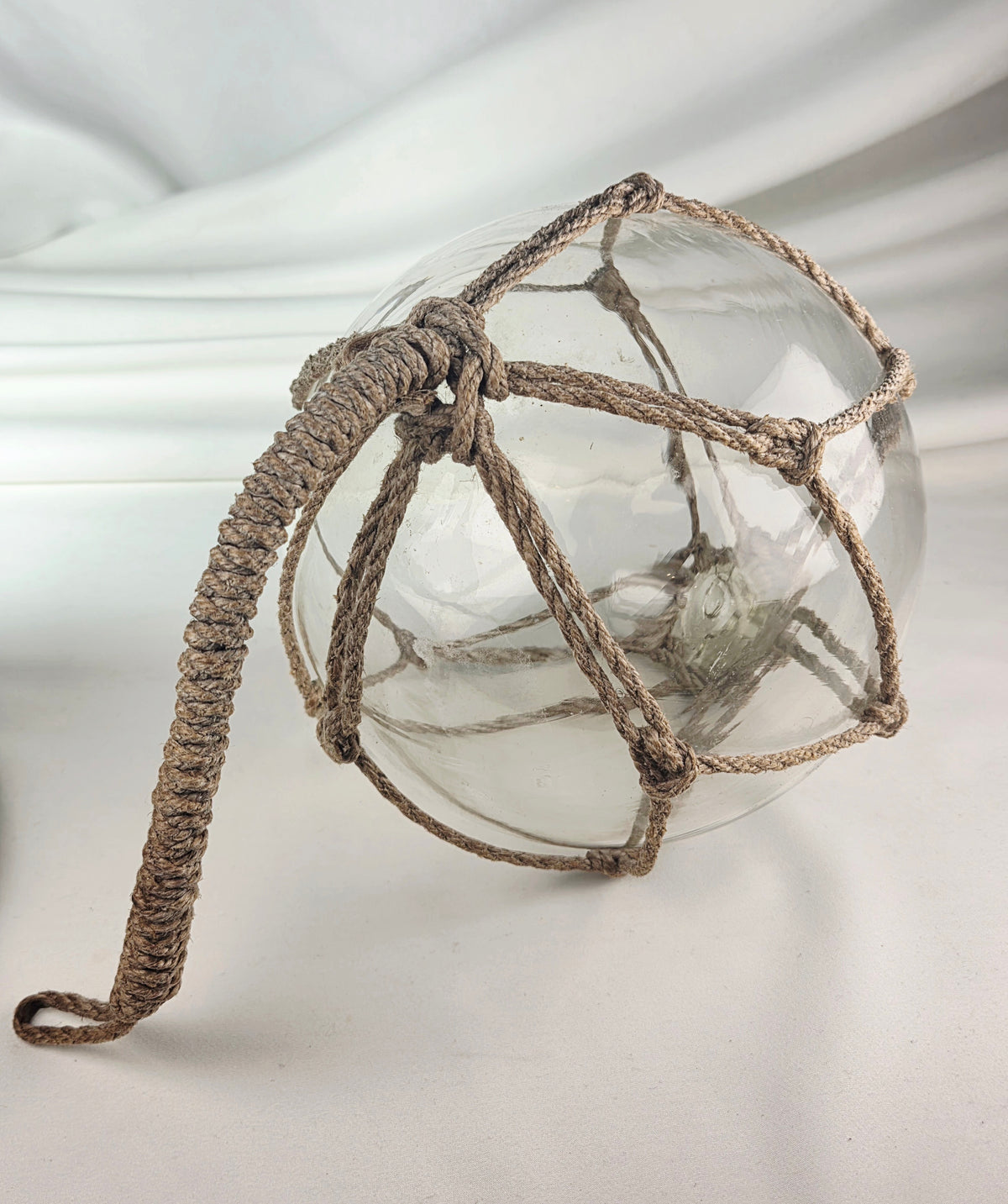 Vintage Clear Glass Fishing Float with Intricate Rope Netting – 7" Coastal Buoy with Internal "Sea-Mist" Patina Hand Blown